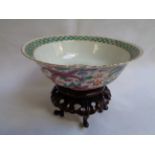 Chinese 20thC Bowl on wooden carved base decorated with Dragon Roundel to interior and floral