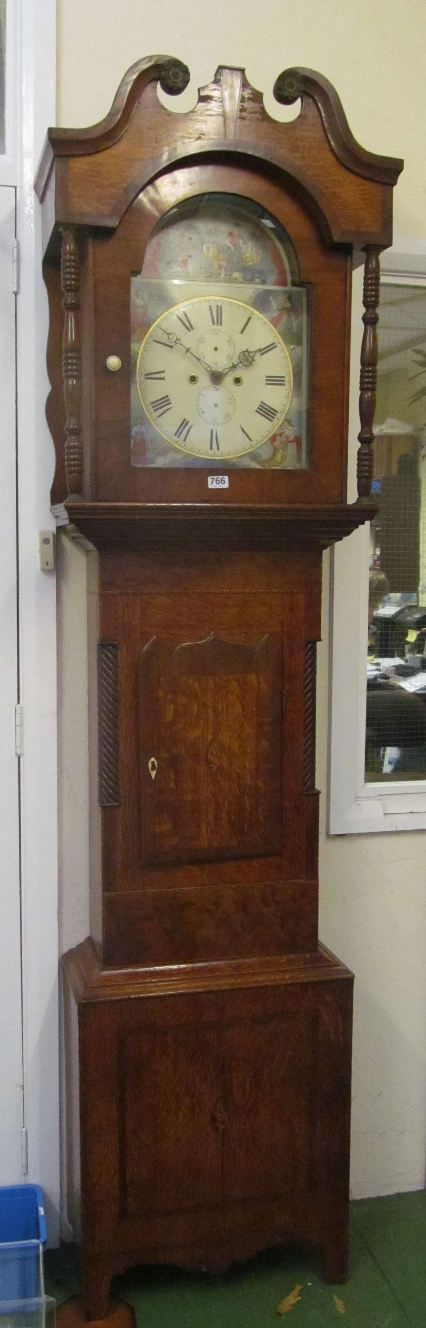 A 19th Century oak cased Longcase clock with arched painted dial, decorated figures and eight day
