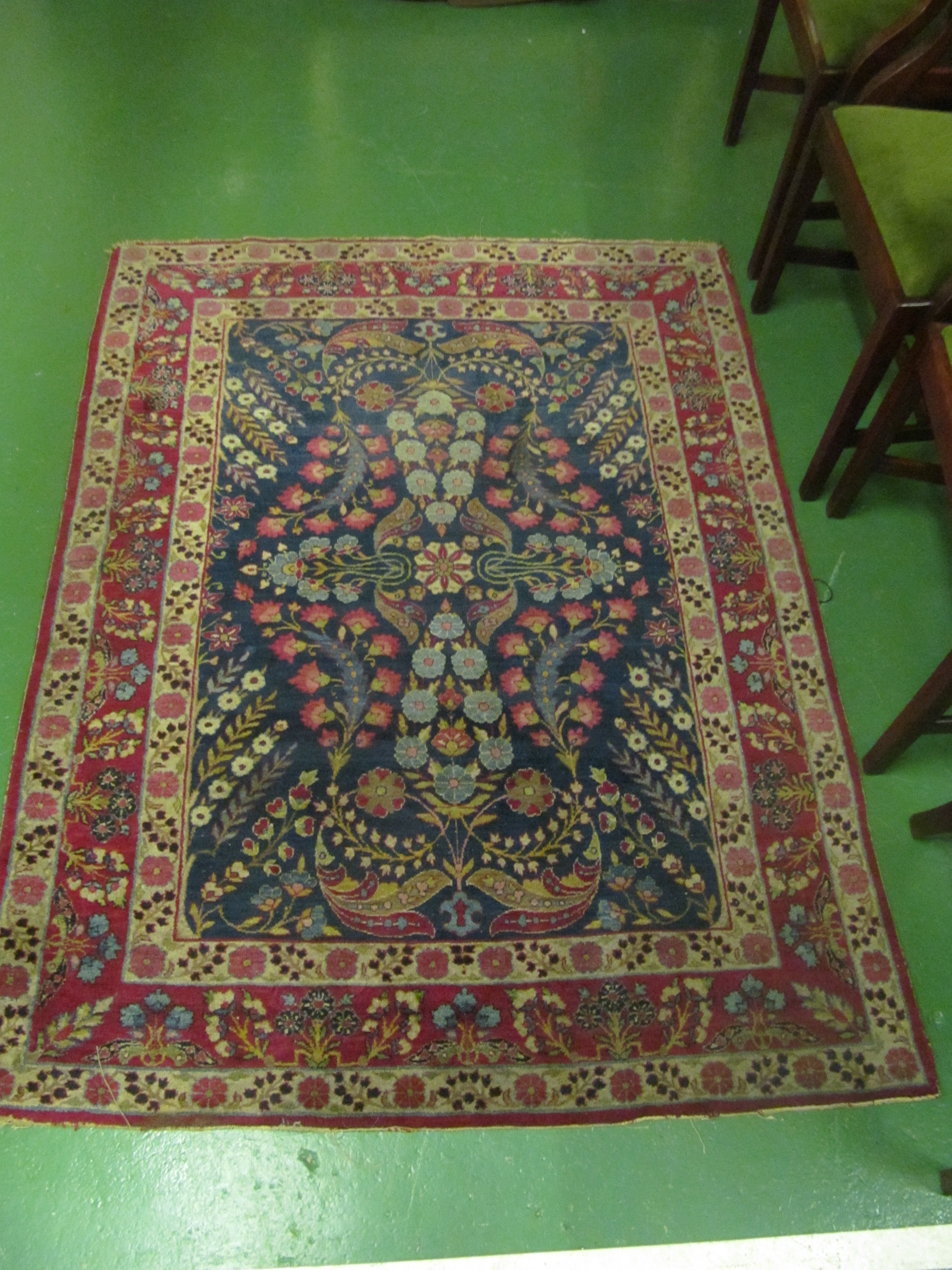 A Kelim style rug blue ground with madder borders overall decoration flowers