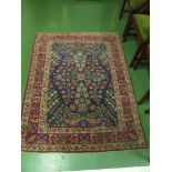 A Kelim style rug blue ground with madder borders overall decoration flowers