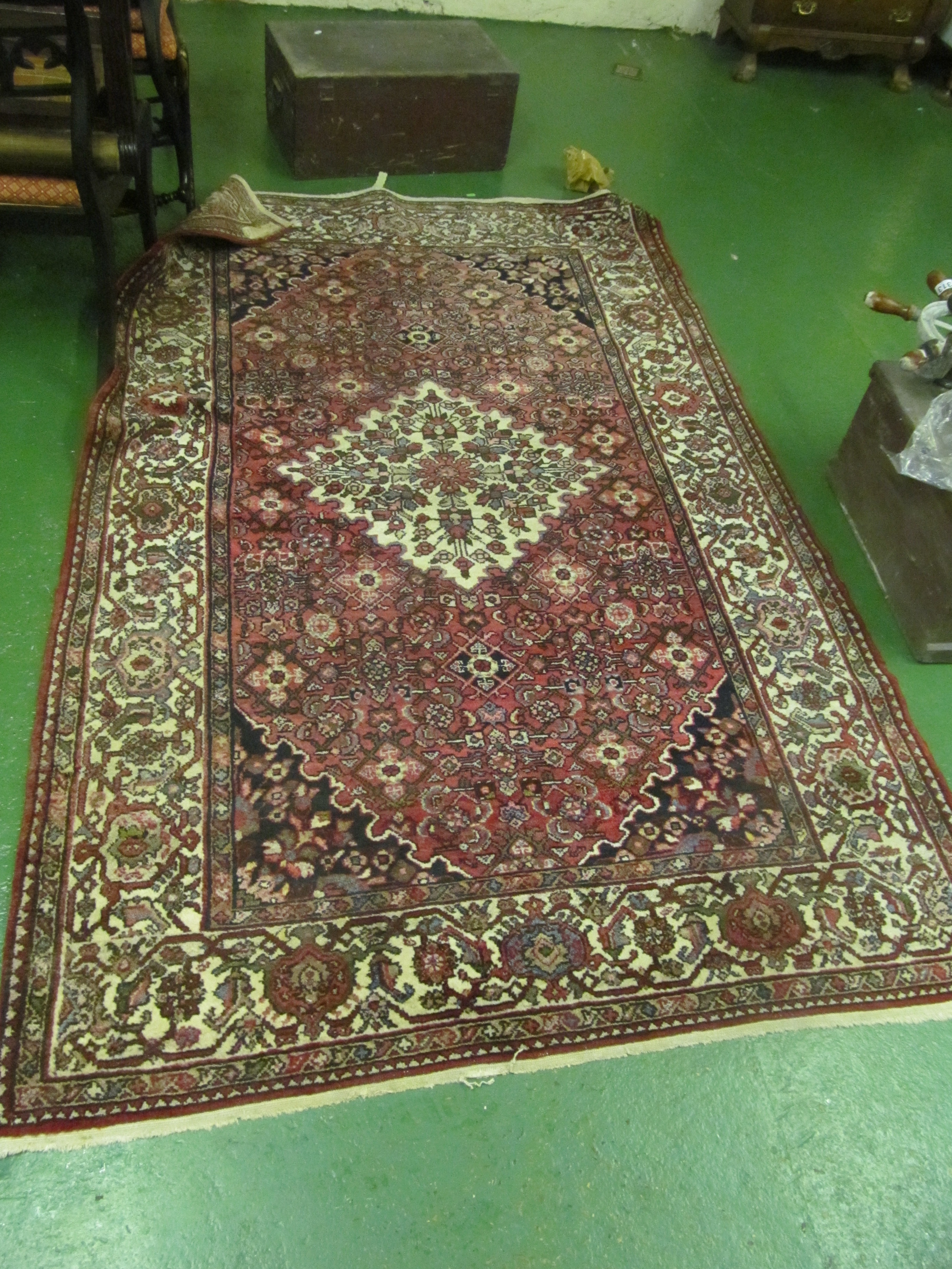 A Persian rug madder ground