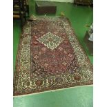 A Persian rug madder ground