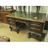 An oak desk with drawers on cabriole legs