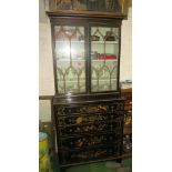 A 19th Century black lacquer secretaire bookcase, two doors above secretaire double drawer front and
