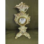 A continental flower encrusted porcelain clock.