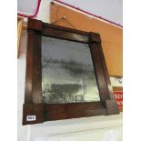 A rosewood bevelled glass mirror