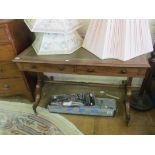 A 19th Century mahogany desk on twin pillar supports with two drawers