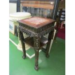 An oriental marble top two tier plant stand.