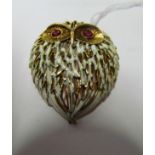 An 18ct gold and an enamel owl brooch with ruby style eyes.