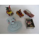 A Corgi Noddy car, a Basil Brush car, a few Robinson jam labels, a Monkee mobile, and a space ship.