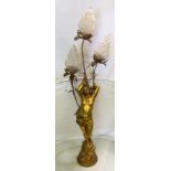 A giltwood floorstanding lamp of semi-nude lady with three flame opaque shades (1 a/f)