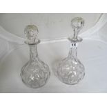 A pair of 19th Century glass decanters.