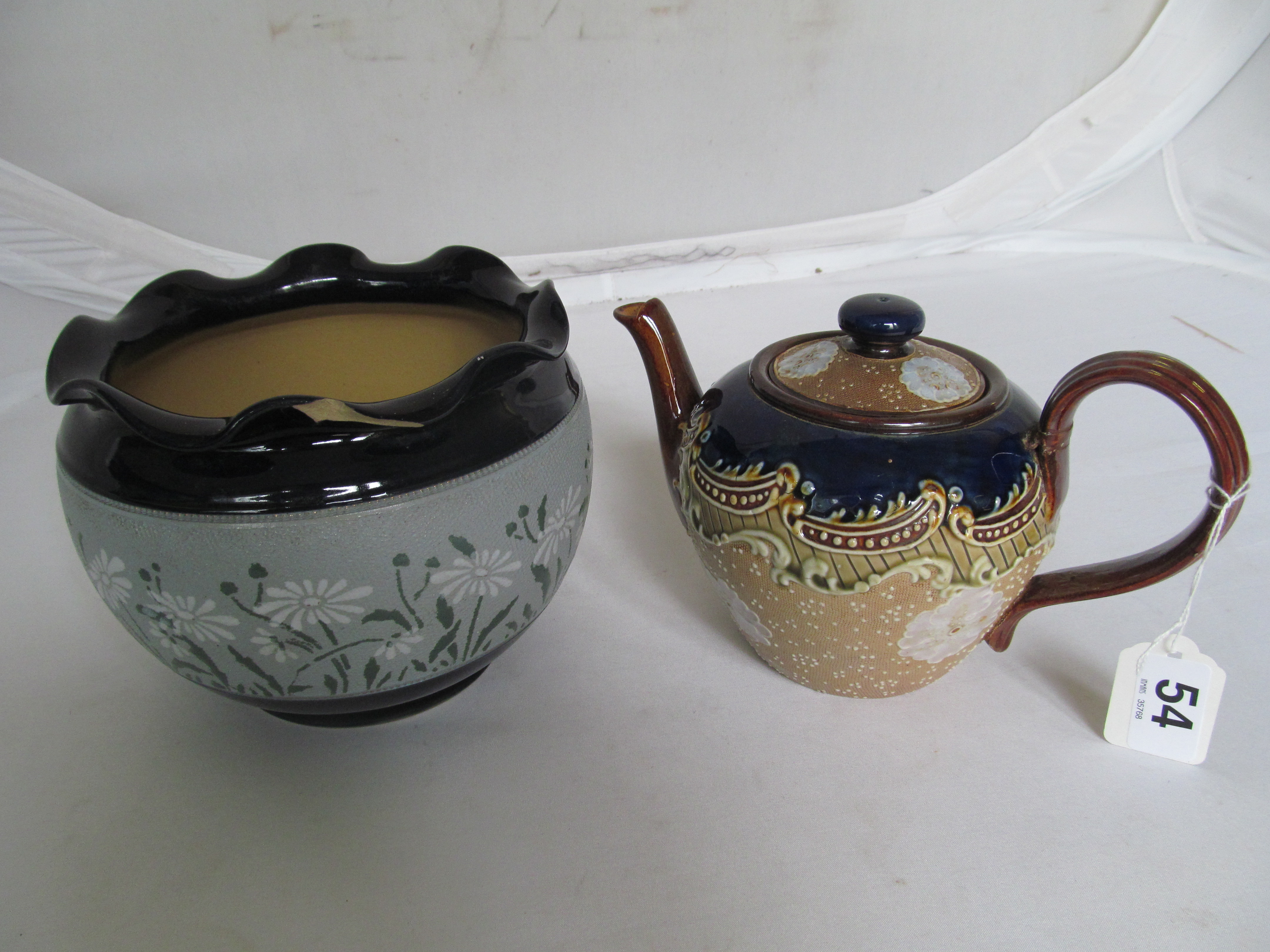 A Doulton Lambeth stoneware teapot and a Langley Pottery jardinière (a/f)