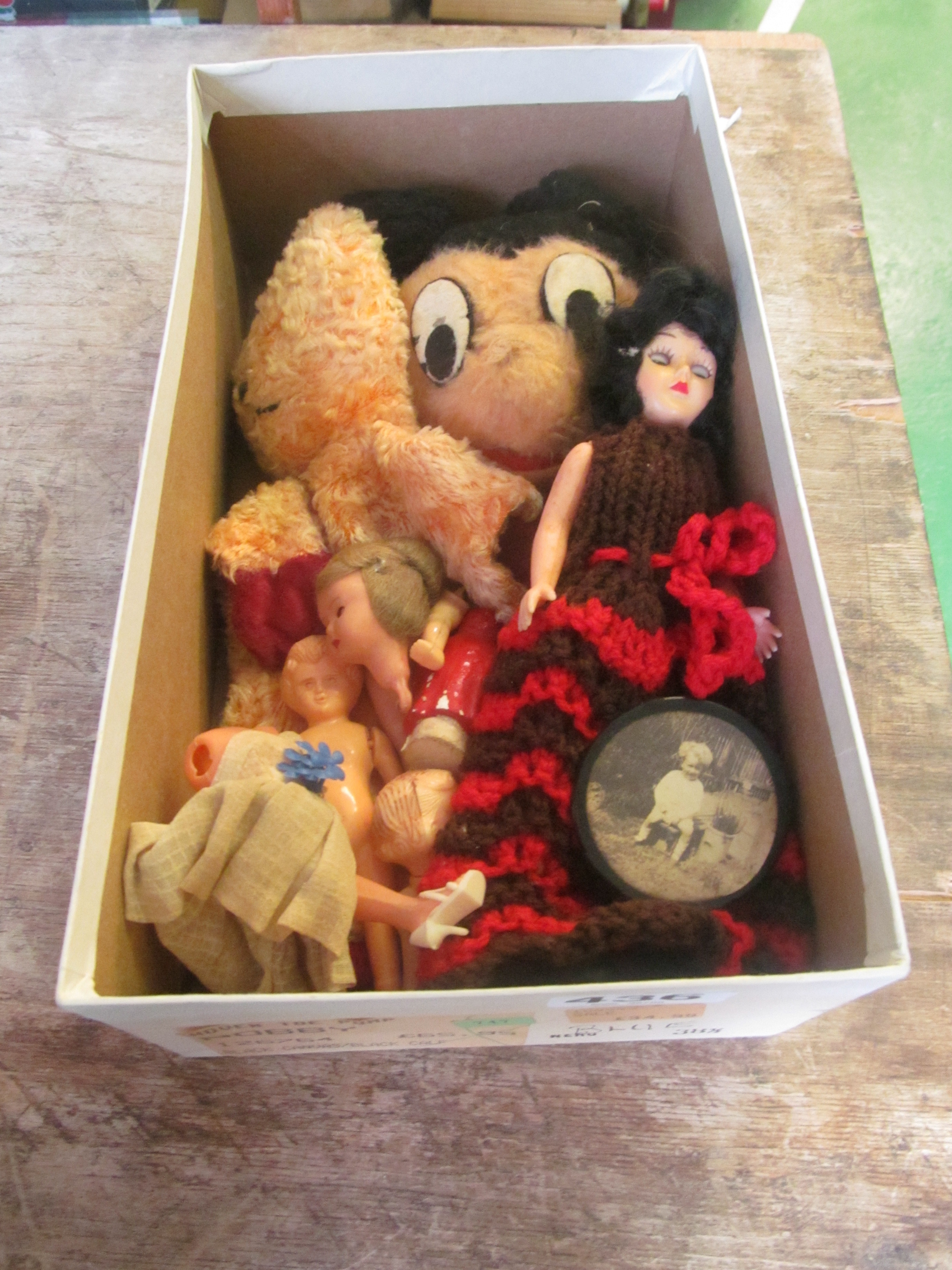A Mickey Mouse puppet and other dolls.