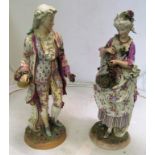 A pair of French porcelain figures of gallant and lady on circular bases