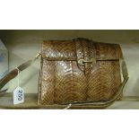 A vintage snakeskin handbag