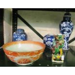 An oriental blue baluster lidded vase, two ginger jars, a Kutani style bowl and a kylin lion