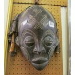 An African mask with ringlets