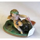 A Sarregeum majolica pottery figure cherub riding a fish