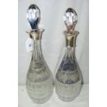 A silver mounted cut glass decanter with overlay decoration to the neck and a near-matching ditto