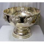 A 39cm diameter plated punch bowl with grape and vine leaf decoration to the rim