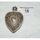 A heart-shaped silver scent bottle with scrolling decoration and screw top by Deakin & Francis -