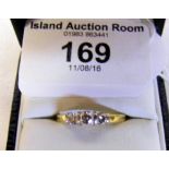 An 18ct yellow gold three stone diamond ring - .52 carat diamond colour "H" and diamond clarity "Si"