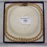 A two string cultured pearl necklace with gold set seed pearl star clasp in original box