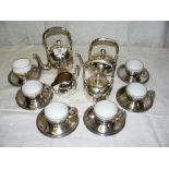 A 16-piece Chinese style silver tea set with porcelain liners to the cups-possibly Spanish silver