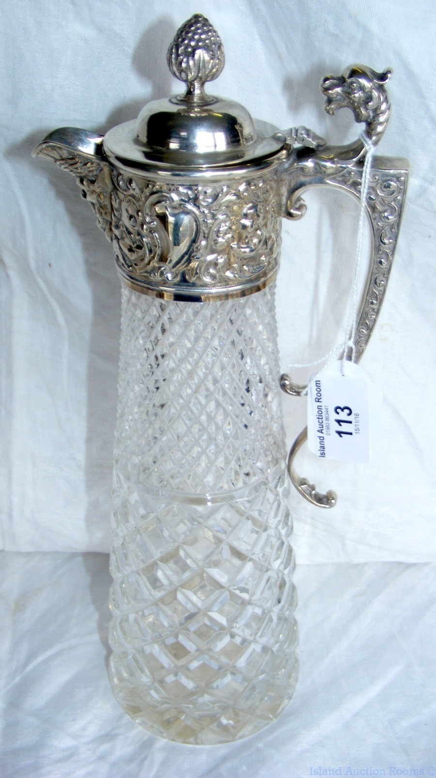 Silver mounted cut glass claret jug, having stylized Dragon to the handle - 30cm high