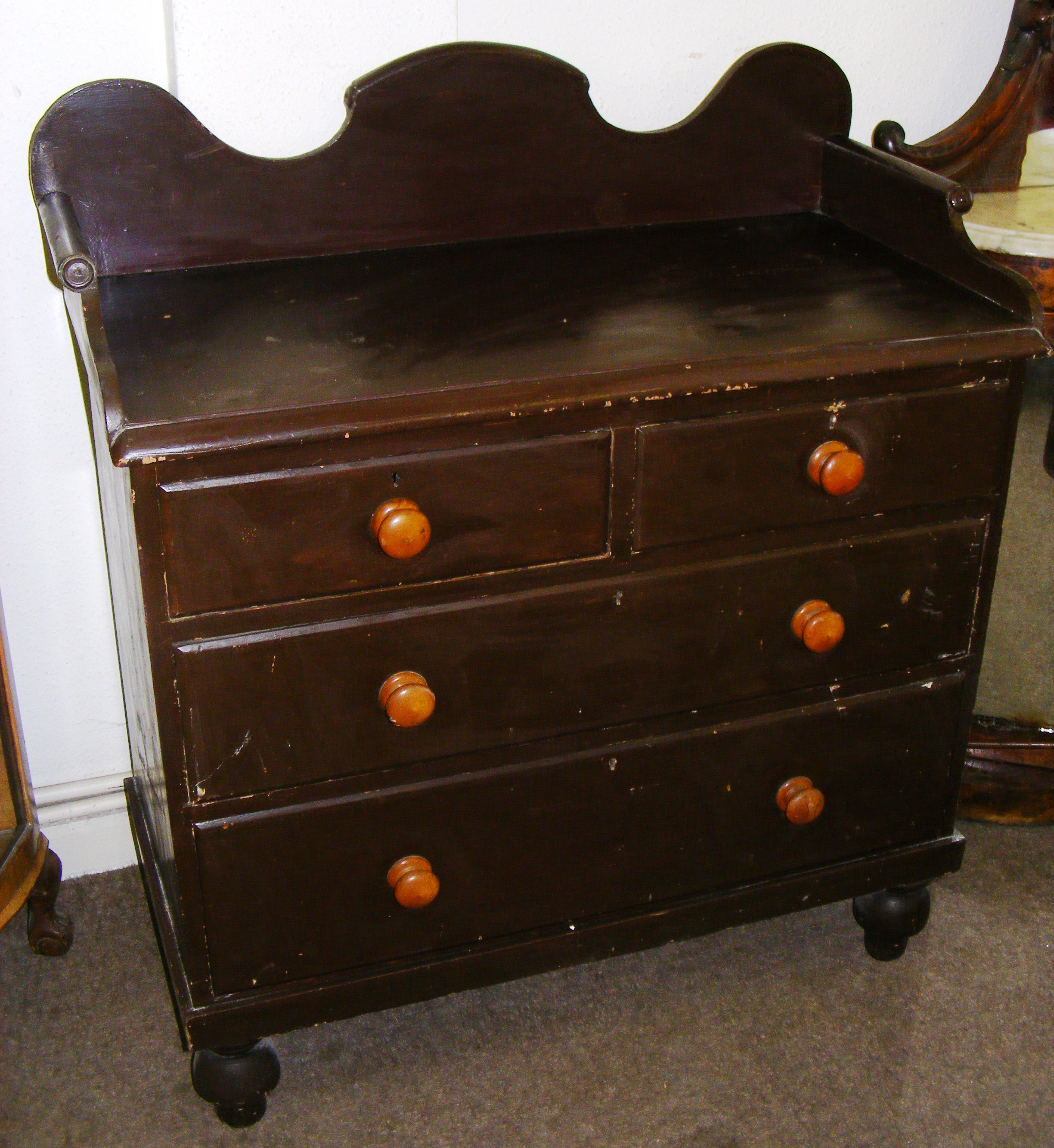 A pine chest of drawers.