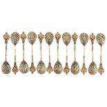 A SET OF TWELVE RUSSIAN SILVER GILT AND SHADED ENAMEL DEMITASSE SPOONS, 11TH ARTEL, MOSCOW, 1908-