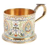 A VERY FINE SILVER GILT AND ENAMELED TEA GLASS HOLDER, OVCHINNIKOV, MOSCOW, 1908-1917. The heavy