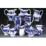 A GROUP OF NINE ENGLISH STAFFORDSHIRE FLOW BLUE TABLE PIECES, MOSTLY 19TH CENTURY. Comprising