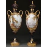 A LARGE PAIR OF SEVRES STYLE HAND PAINTED PORCELAIN AND GILT BRONZE COVERED URNS, LATE 19TH
