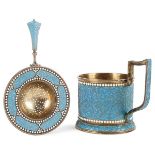 A RUSSIAN SILVER GILT AND ENAMELED TEA CUP HOLDER, MOSCOW, 1892. Resting on a slightly flared foot,