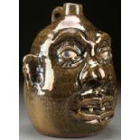 A LANIER MEADERS GLAZED POTTERY FACE JUG, THIRD QUARTER 2OTH CENTURY. Hand sculpted in the form of