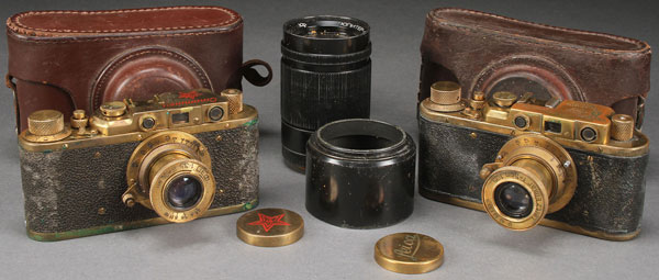 A PAIR OF RUSSIAN SOVIET PERIOD MADE COPIES OF LEICA CAMERAS. Including one bearing German WWII