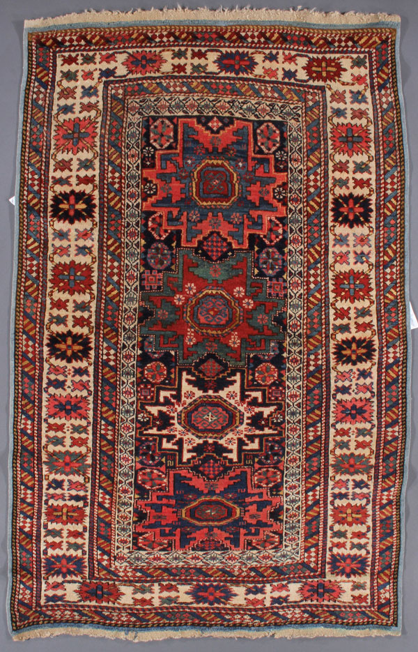 A GOOD SHIRVAN ORIENTAL, EAST CAUCASUS, CIRCA 1910. With four closely spaced medallions, one in