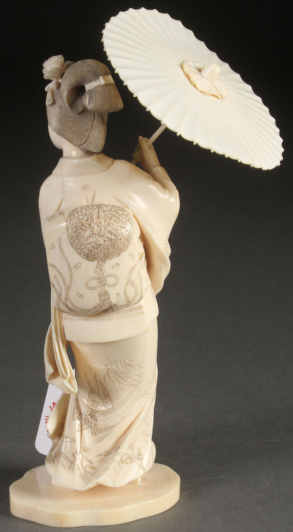 A VERY FINE JAPANESE CARVED IVORY OKIMONO OF A GEISHA, MEIJI PERIOD. Depicted with a windswept gown - Image 2 of 4