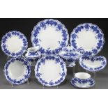 A COLLECTION OF GRINDLEY ENGLISH FLOW BLUE “CLARENCE” DINNERWARE, 19TH CENTURY. An assembled set of