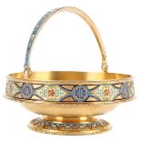 AN ATTRACTIVE RUSSIAN SILVER GILT AND ENAMEL BASKET, MOSCOW, DATED 1885. Resting on a slightly
