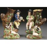 A PAIR OF STAFFORDSHIRE FIGURAL SPILL VASES OF MUSICIANS, CIRCA 1820. Depicting a man with drum and