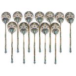 A SET OF TWELVE RUSSIAN SILVER GILT AND ENAMELED TEA SPOONS, OVCHINNIKOV, MOSCOW, 1908-1917.