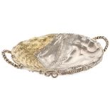 A RUSSIAN SILVER GILT TROMPE L’OEIL CANDY TRAY, MOSCOW, 1874. Resting on a twisted wire foot and