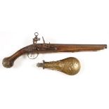 AN ATTRACTIVE FLINTLOCK HOLSTER PISTOL, 19TH CENTURY. Walnut fullstock and deeply embossed European