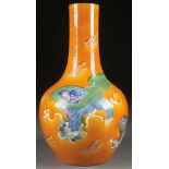 A CHINESE SANCAI GLAZED BOTTLE VASE, 19TH CENTURY. Decorated with temple lions in green, blue and