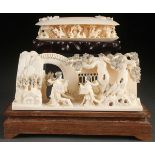 A FINE PAIR OF ORIENTAL CARVED IVORY ORNAMENTS, CIRCA 1950. Comprising a well carved Chinese scene