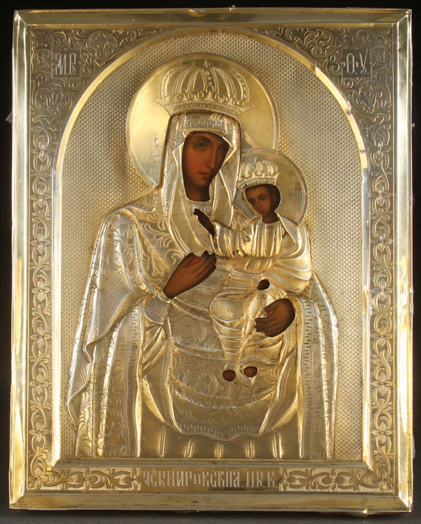 A RUSSIAN ICON OF THE CHERNIGOVSKAYA MOTHER OF GOD, CIRCA 1900. Finely painted on an incised gilt