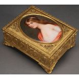 A HAND PAINTED PORCELAIN PORTRAIT AND GILT BRONZE DRESSER BOX, CIRCA 1900, PROBABLY AUSTRIAN. The